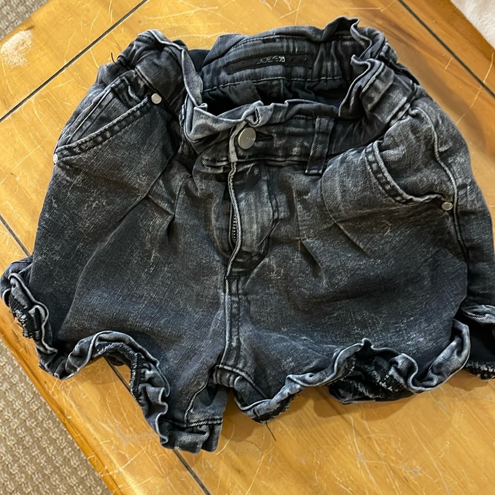 Girls size 10 Joes Jeans  ruffle edged shorts. Stone washed black color.
